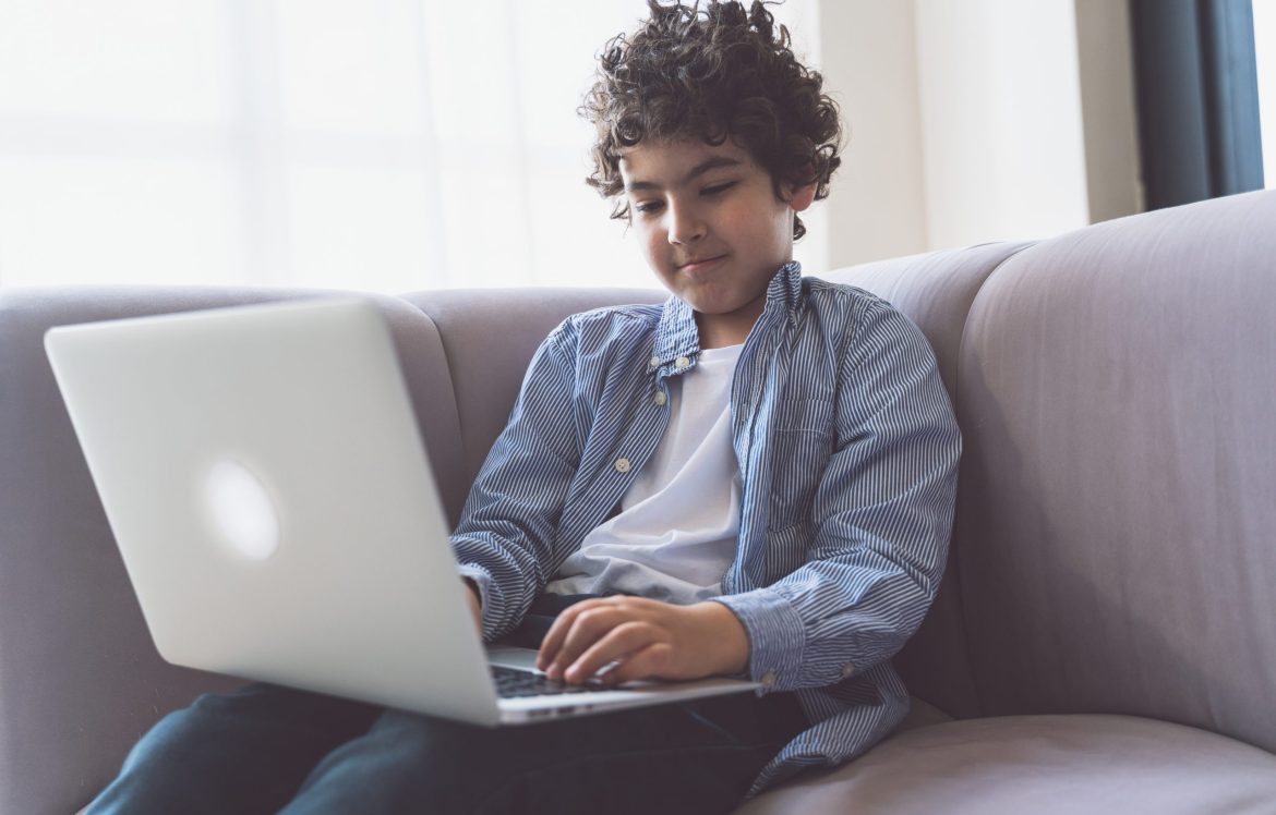 Little,Kid,Studying,On,His,Laptop.,Concept,About,Childhood,And